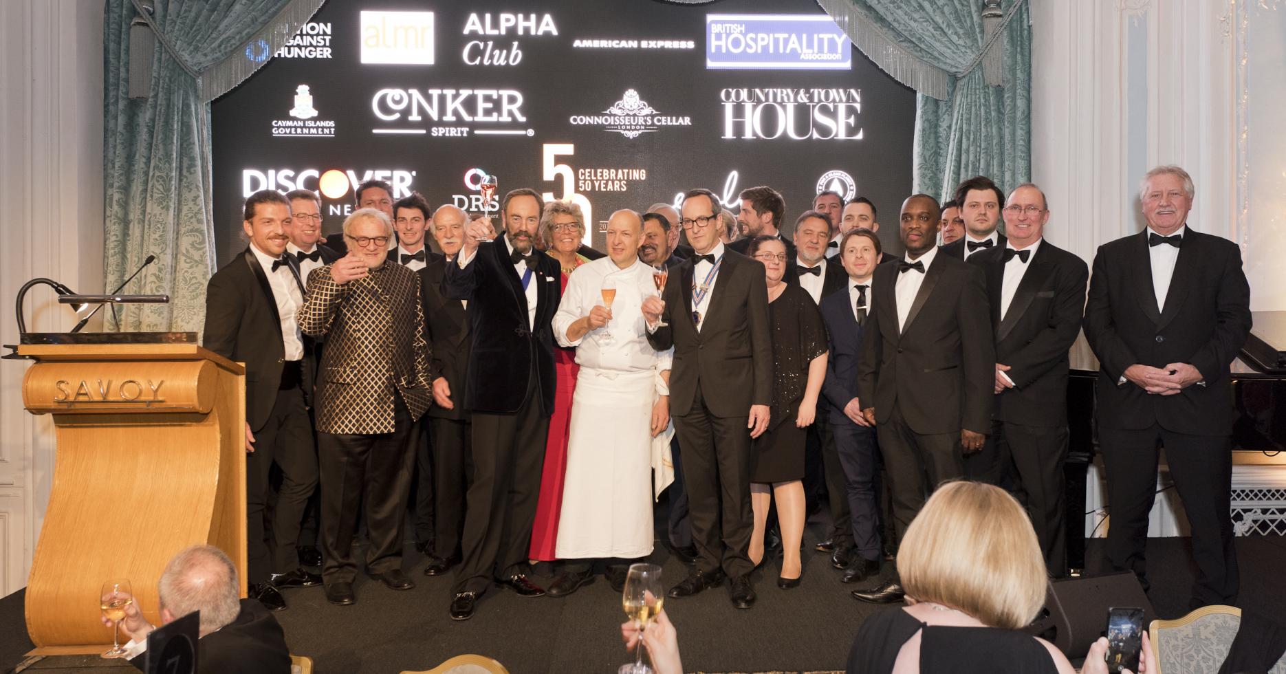 Bob Walton leads guests in toasting the Restaurant Association Restaurant Association 50th anniversary