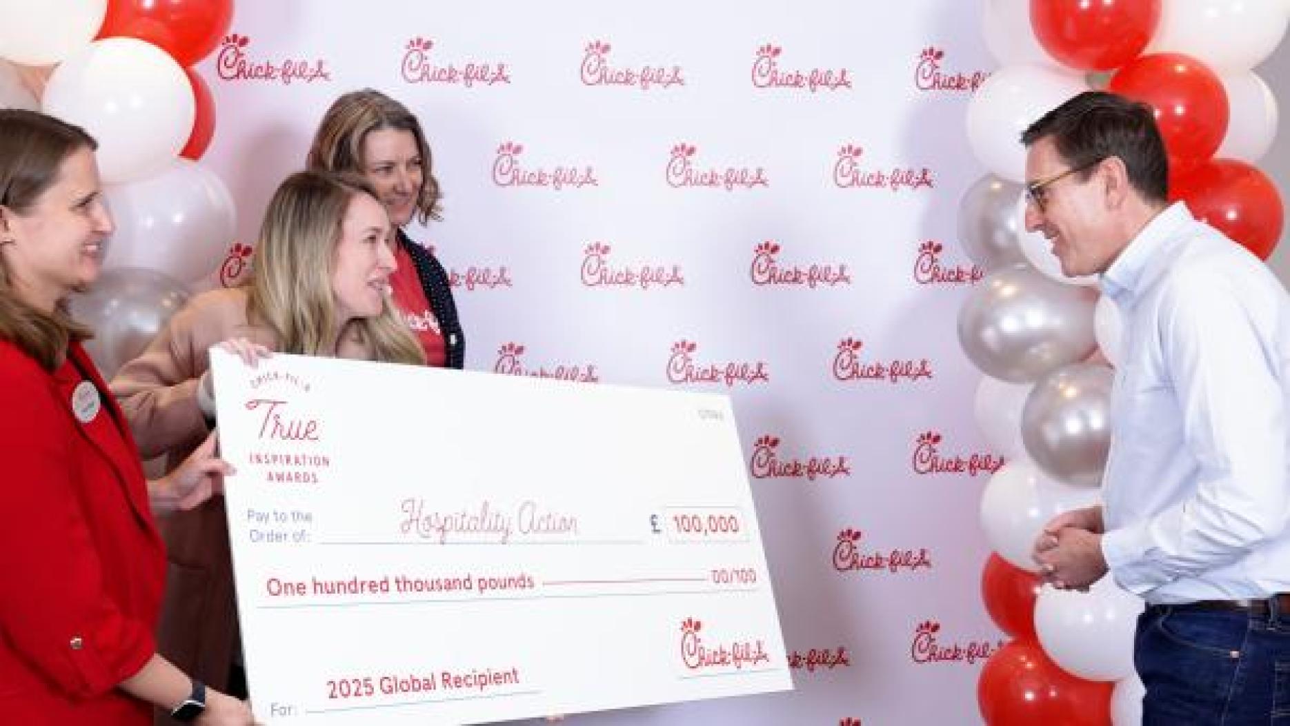 Mark Lewis, CEO of Hospitality Action receives cheque Mark Lewis, CEO of Hospitality Action receives cheque