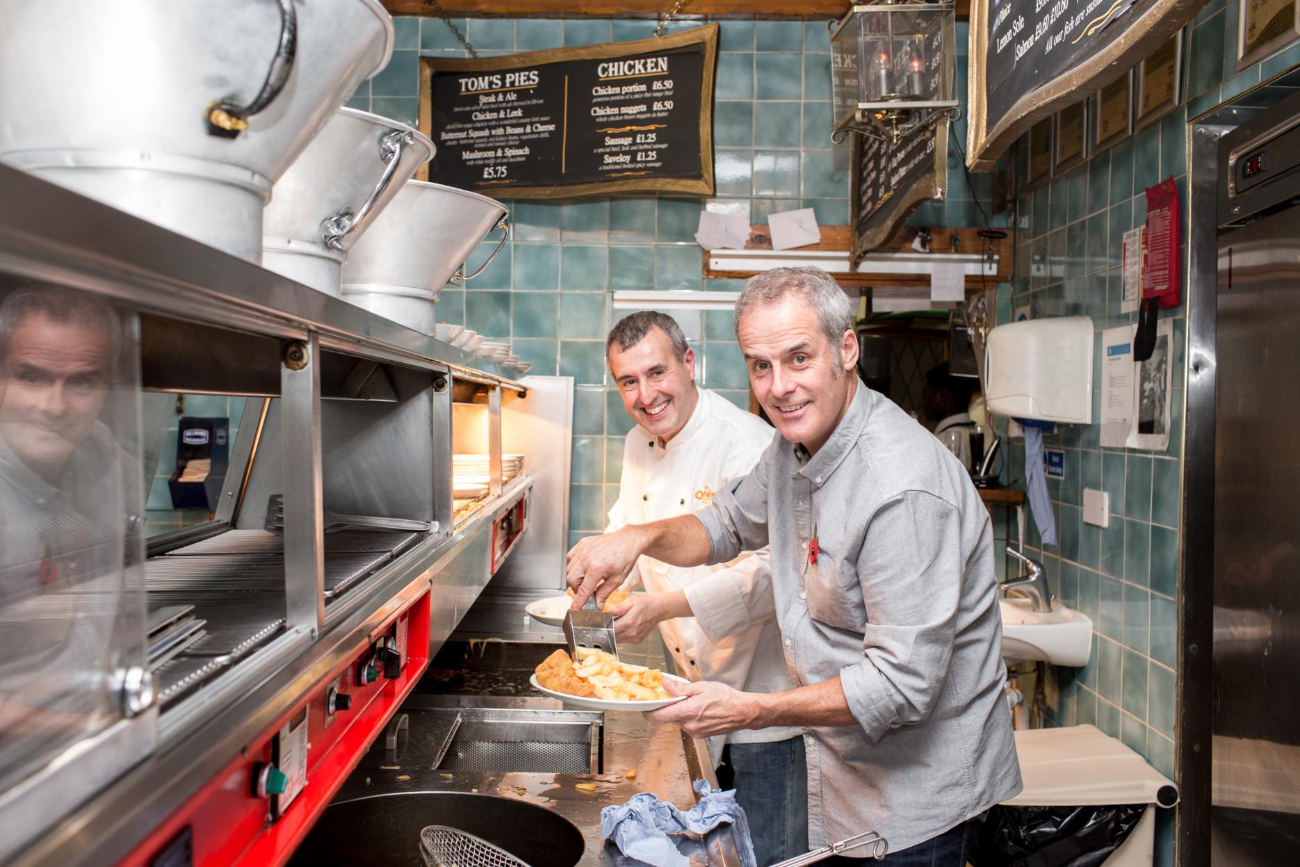 Phil Vickery and Harry Niazi from Olley's Fish Experience serving up gluten-free fish and chips