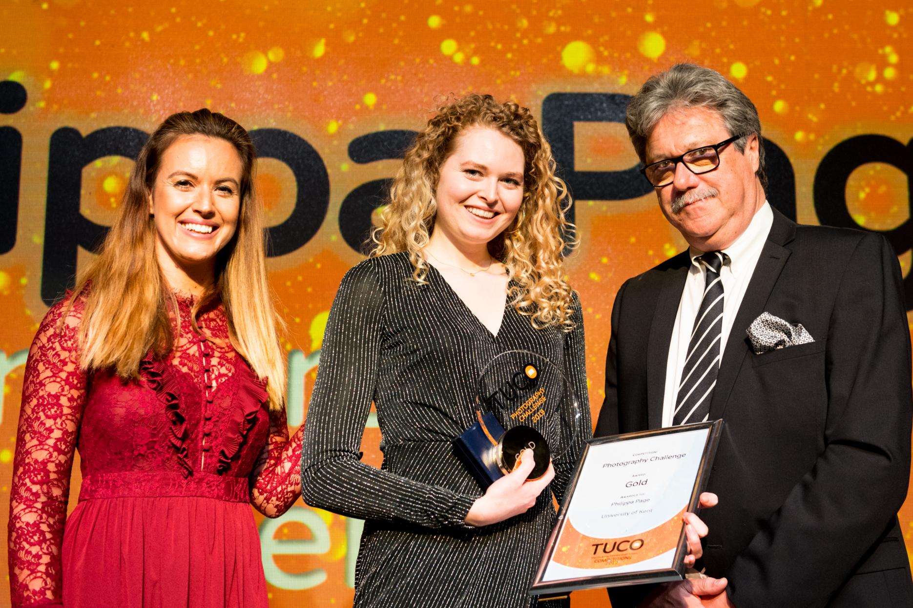 Winner of the new photography challenge, Philippa Page from University of Kent flanked by TV presenter Charlie Webster and chef Kevin Byrne TUCO announces competitions winners